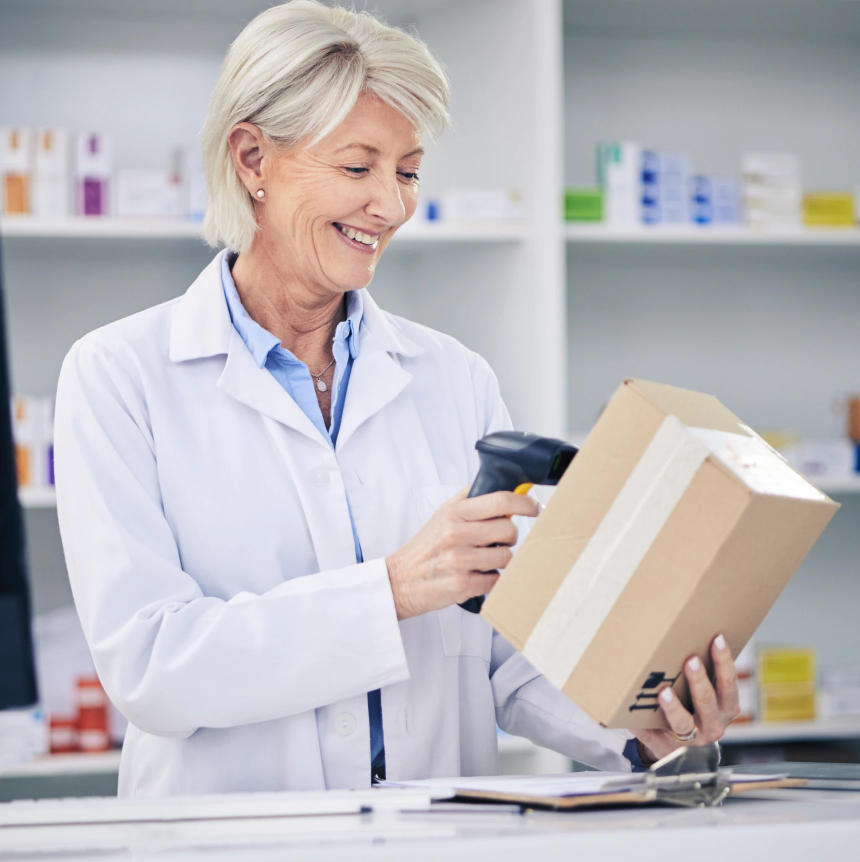 Woman pharmacist using barcode scanner