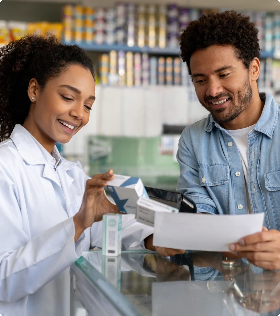 Customer buying medicine at pharmacy counter